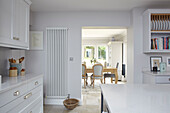 View through doorway from kitchen with with wall mounted radiator and plate rack to dining room Buckinghamshire UK