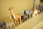 Close up of wooden toy animals going two by two