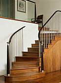 Bespoke staircase made of American black walnut leather and steel in hall