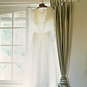 Window with white dress and drapes