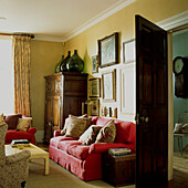 Comfortable sitting room with red linen sofa