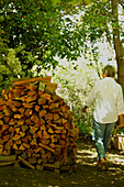 Walking past chopped firewood