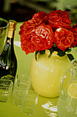 Rote Rosen und Champagner