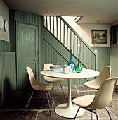 Modern table and chairs in panelled hallway