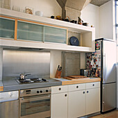 Stainless steel and white kitchen with cooker
