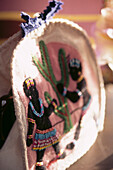 Colourful hand embroidered felt tea cosy