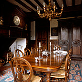 Large mahogany dining table and chairs in a rustic country dining room