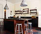Kitchen decorated with a mixture of original pieces traditional dairy tiles granite work surfaces