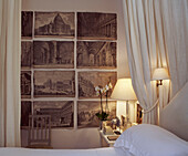 Bedroom decorated with old prints
