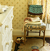 Chair by dresser in bedroom