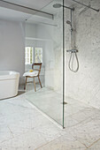 Marble tiled bathroom with wetroom shower