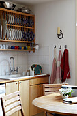 Kitchen with open crockery rack storage shelf
