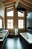 High beamed tiled bathroom in luxury Zermatt home, Switzerland