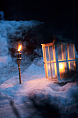 Lit lanterns in snow, Zermatt, Valais, Switzerland
