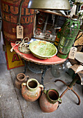 Collection of objects on side table in Evershot antique shop, Dorset, kent, UK