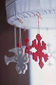 Christmas decorations pegged on to a lampshade
