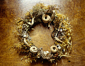 Wreath of dried plants and found objects