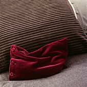 Grey and red velvet cushion detail