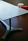 Metal table on painted cement finished flooring