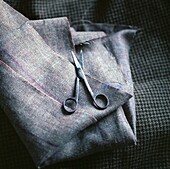 Brown textile and scissors