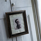 Black and white picture of native American hanging on closet doors