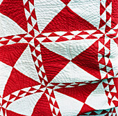 Red and white patchwork quilt