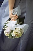 Bride holding white wedding bouquet