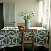 English 'Green and White Maze' quilt from the 1860's on a country kitchen dining table