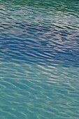 Ripples in crystal clear blue water in the Maldives
