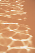 Water ripples reflected on a surface