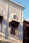 Exterior view of ornate building with stuccowork in Fez Morocco