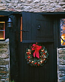 Christmas wreath on black stable door