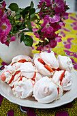 Cut flowers and strawberry meringues in contemporary Lewes home,  East Sussex,  England,  UK