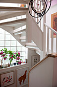 White painted staircase and artwork in Lewes home,  East Sussex,  England,  UK