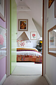 View through green doorway to bedroom in Lewes home,  East Sussex,  England,  UK