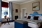 Mix of blue fabrics in bedroom of Tiverton country home,  Devon,  England,  UK