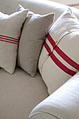 Striped cushions on sofa in Kingston home,  East Sussex,  England,  UK