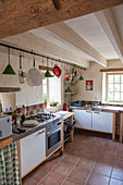 Kitchenware on rail in Lotte et Garonne farmhouse  France