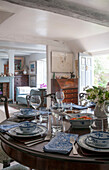 Blue and white chinaware on wooden dining table in Dorset home  Kent  UK