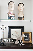'Beware of dog' sign with model head and framed artwork in South Kensington townhouse  London  UK