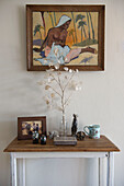 Dried flowers and ornaments with framed painting in18th century Norfolk barn conversion  England  UK