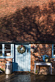 Milk churn at door of tiled Grade II listed cottage  Kent
