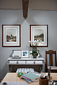 White orchids and artworks with upcycled side table in Oxfordshire barn conversion  England  UK