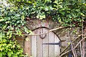 Horseshoe on garden gate in Amberley garden West Sussex UK