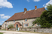 Tiled roof on detached stone farmhouse in Petworth England UK