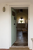 View through front door to flagstone hallway of Petworth farmhouse West Sussex Kent