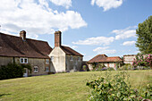 Lawned exterior of tiled farmhouse in Petworth West Sussex Kent