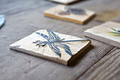 Carved wooden block with dragonfly print in artist's studio Cornwall UK