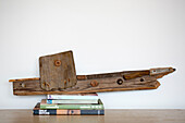 Driftwood aeroplane and books in West Wittering home West Sussex England