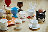 Selection of egg-cups on kitchen worktop in London family home  England  UK